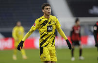 Dortmund's Giovanni Reyna reacts during the German Bundesliga soccer match between Eintracht Frankfurt and Borussia Dortmund in Frankfurt, Germany, Saturday, Dec. 5, 2020. (AP Photo/Michael Probst, Pool)