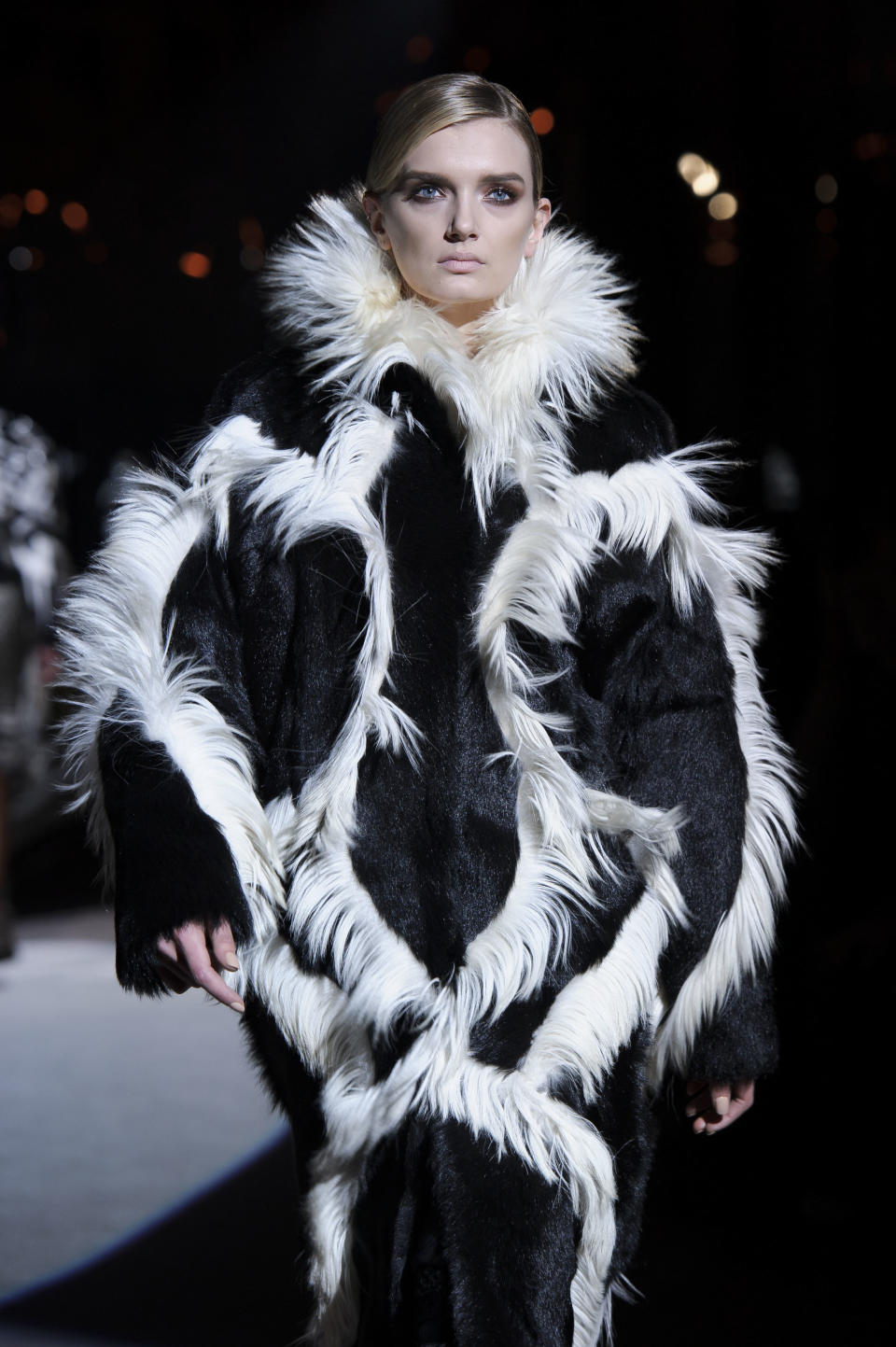 A model wears a design from the Tom Ford collection during London Fashion Week, Monday, Feb. 18, 2013, London. (Photo by Jonathan Short/Invision/AP)