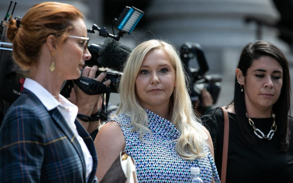 Virginia Giuffre, an alleged victim of Jeffrey Epstein, centre, exits from federal court in New York  - Bloomberg