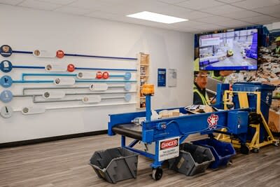 Educational displays detail the recycling process while visitors are able to try their hand at sorting on the miniature conveyor belt.