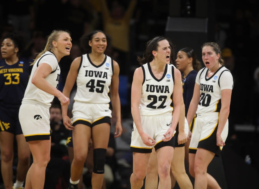 IOWA CITY, IOWA- MARCH 25: Guard Caitlin Clark #22 of the Iowa Hawkeyes celebrates after drawing a foul on a basket during the second half against the West Virginia Mountaineers during their second round match-up in the 2024 NCAA Division 1 Women’s Basketball Championship at Carver-Hawkeye Arena on March 25, 2024 in Iowa City, Iowa. (Photo by Matthew Holst/Getty Images)