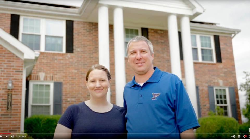 In this 2021 file photo, Jennifer and Mark Bassler are shown in front of their home on Fairway Drive in Belleville. The Orchards homeowners association recently motioned to dismiss a lawsuit over their solar panels.