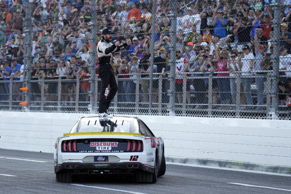 Ryan Blaney celebrates after winning a NASCAR Cup Series auto race at Martinsville Speedway in Martinsville, Va., Sunday, Oct. 29, 2023. (AP Photo/Chuck Burton)