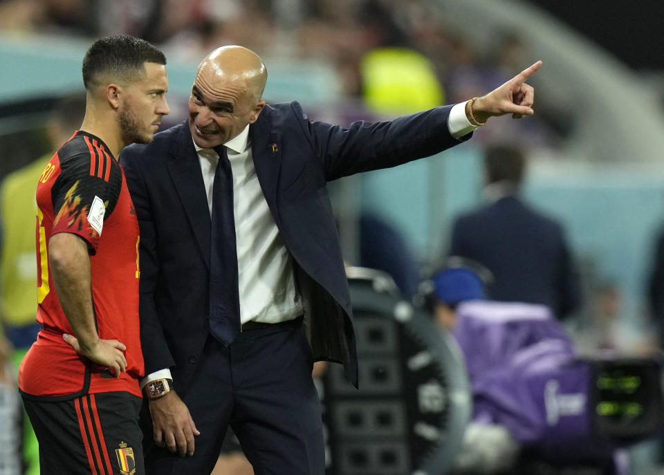 Belgium's head coach Roberto Martinez, right, gives instructions to Belgium's Eden Hazard during the World Cup group F soccer match between Croatia and Belgium at the Ahmad Bin Ali Stadium in Al Rayyan, Qatar, Thursday, Dec. 1, 2022. (AP Photo/Francisco Seco)