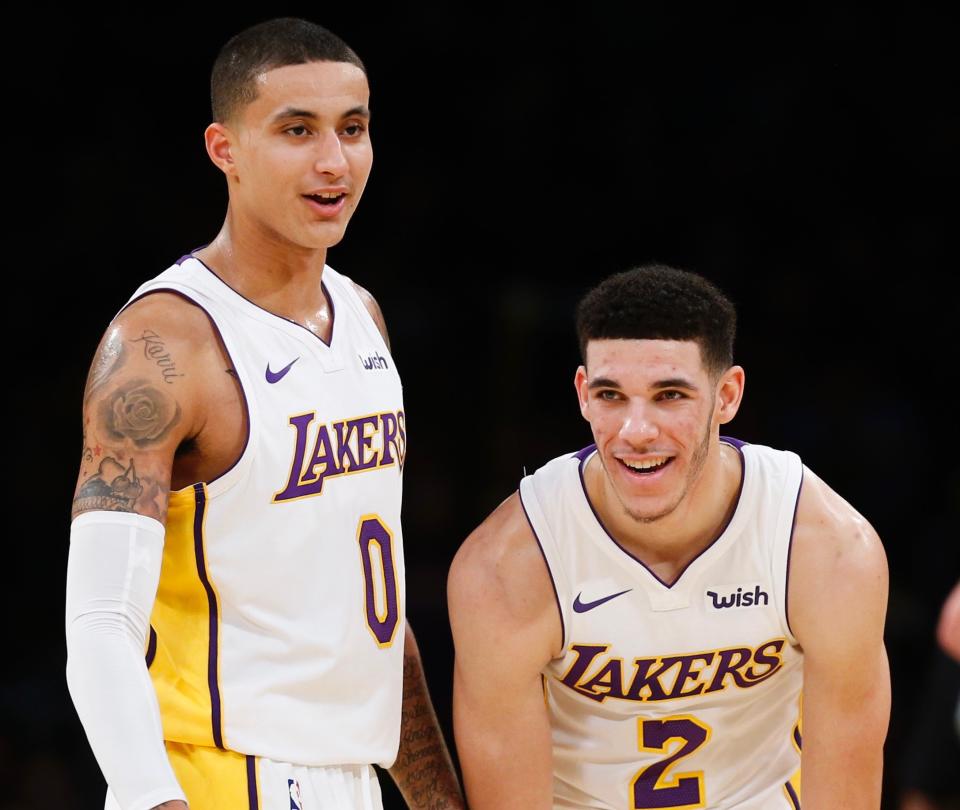 Kyle Kuzma (left) and Lonzo Ball will be toning it down on social media after meeting with the Lakers. (AP Photo/Ringo H.W. Chiu)