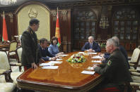 Belarusian President Alexander Lukashenko, centre right, listens to Valery Vakulchik, chief of the Belarusian state security service, KGB, during a meeting of Security Council in Minsk, Belarus, Wednesday, July 29, 2020. Belarusian authorities said Wednesday they have detained dozens of Russian private military contractors days before Belarus' presidential vote, a sign of escalating tensions between the two neighbors. The presidential election in Belarus is scheduled for Aug. 9, 2020. (Nikolai Petrov/BelTA Pool Photo via AP)