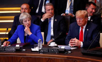 <p>British Prime Minister Theresa May and President Trump attend a meeting of the North Atlantic Council during a NATO summit in Brussels, July 11, 2018. (Photo: Francois Lenoir/Reuters) </p>