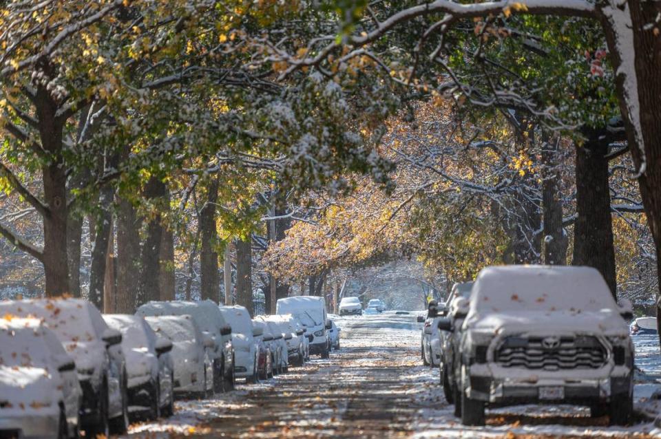 Snow blankets vehicles along Locust Street following Kansas City’s first snowfall of the season on Sunday, Nov. 26, 2023.