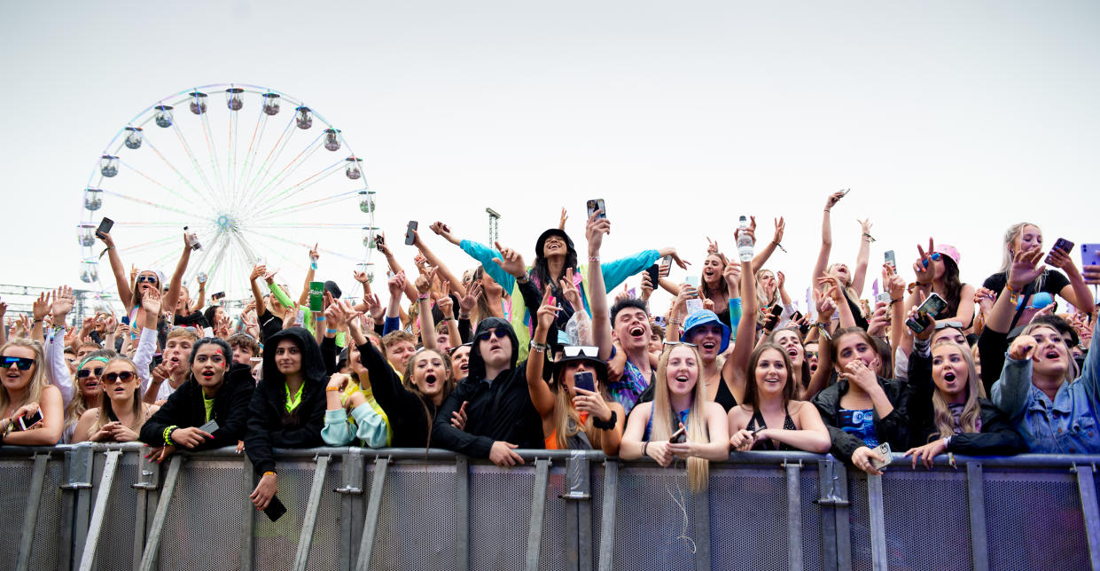 MANCHESTER, ENGLAND - SEPTEMBER 12: Audience members watch Becky Hill perform during Parklife at Heaton Park on September 12, 2021 in Manchester, England. (Photo by Shirlaine Forrest/WireImage)