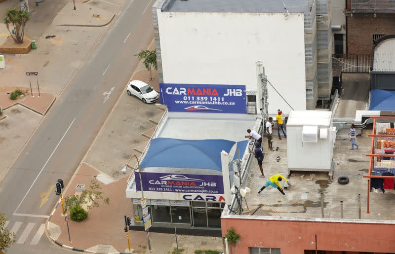 Residents work out on a rooftop during a nationwide lockdown