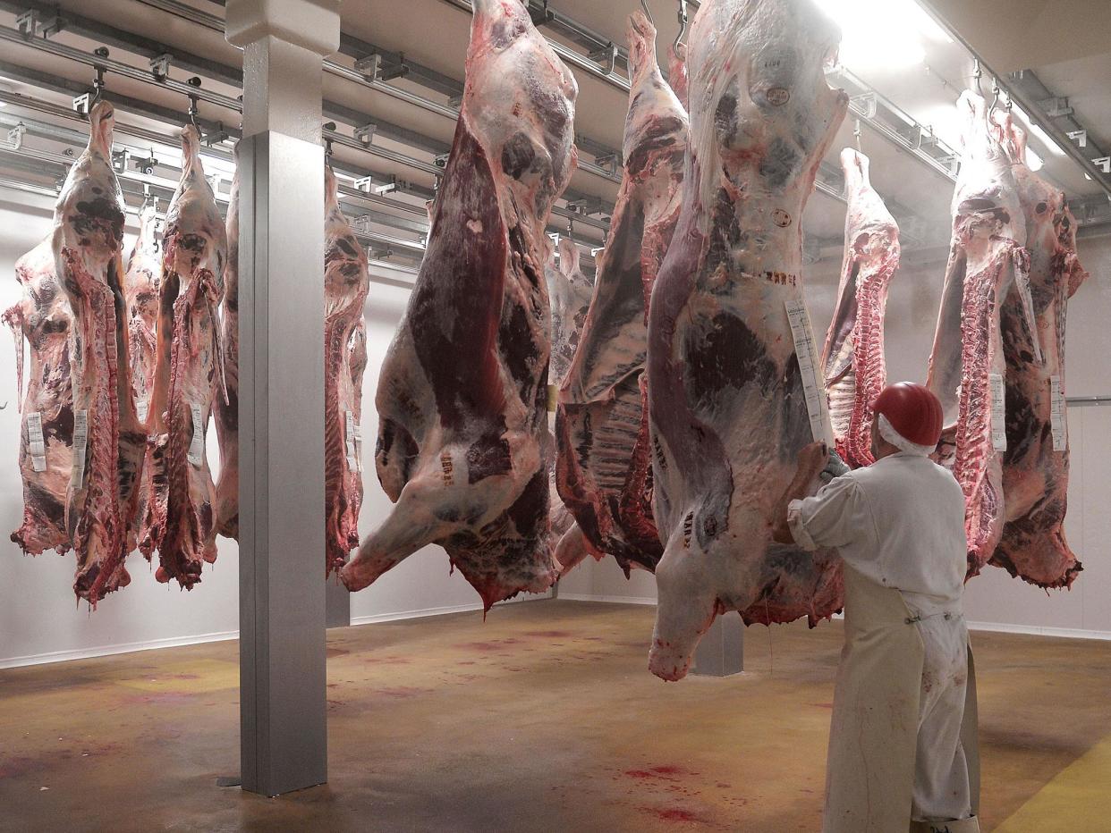 Both Jewish kosher and Islamic halal rituals require the butcher to swiftly slaughter the animal by slitting its throat and draining its blood: Getty