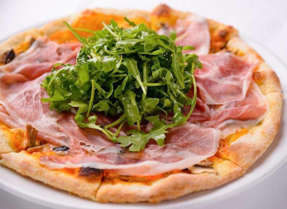 Pizza with prosciutto and arugula from Café Roma in San Luis Obispo.