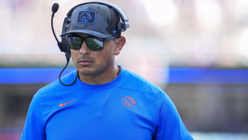 Boise State head coach Andy Avalos walks on the sideline during a game against Washington on  Sept. 2, 2023, in Seattle. On Sunday, the Broncos head coach was fired.