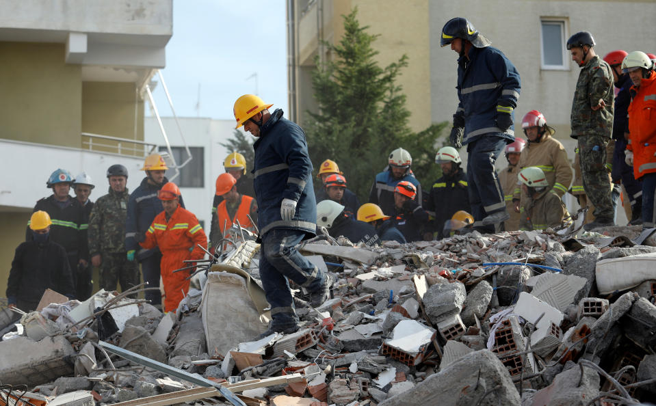 Emergency personnel work at the site of a collapsed building in the town of Durres, following Tuesday's powerful earthquake that shook Albania, November 27, 2019. REUTERS/Florion Goga