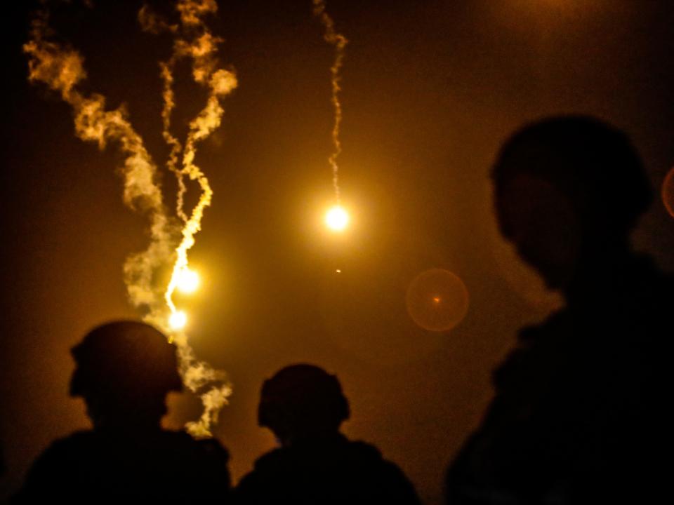 Taiwanese soldiers stand guard as flares are fired during a Taiwanese military live-fire drill, after Beijing increased its military exercises near Taiwan, in Pingtung, Taiwan, 6 September 2022.