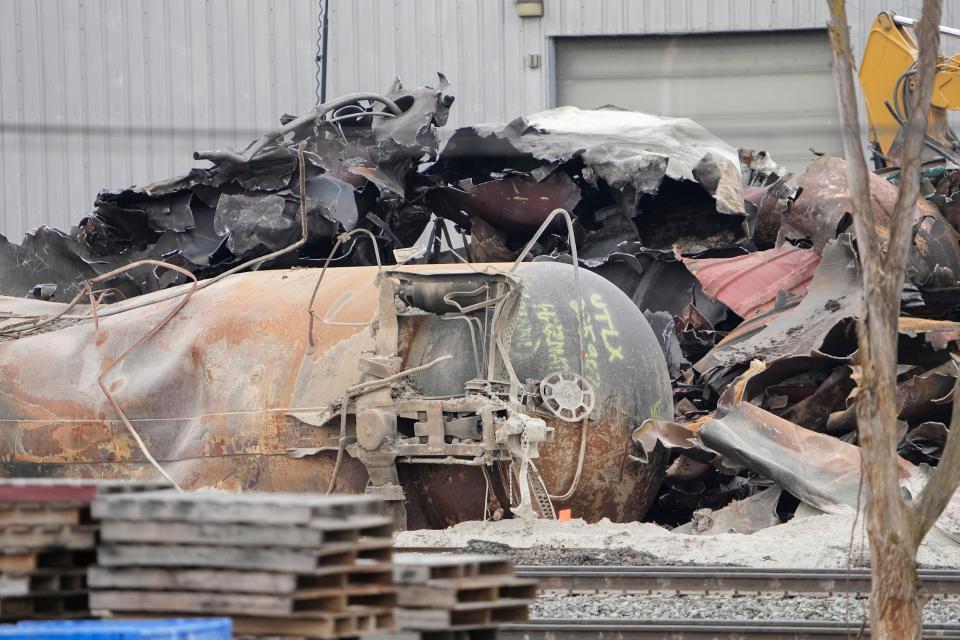 Feb 20, 2023; East Palestine, Ohio, USA;  Workers clean up the wreckage of the Norfolk Southern train derailment in East Palestine.  Mandatory Credit: Adam Cairns-The Columbus Dispatch