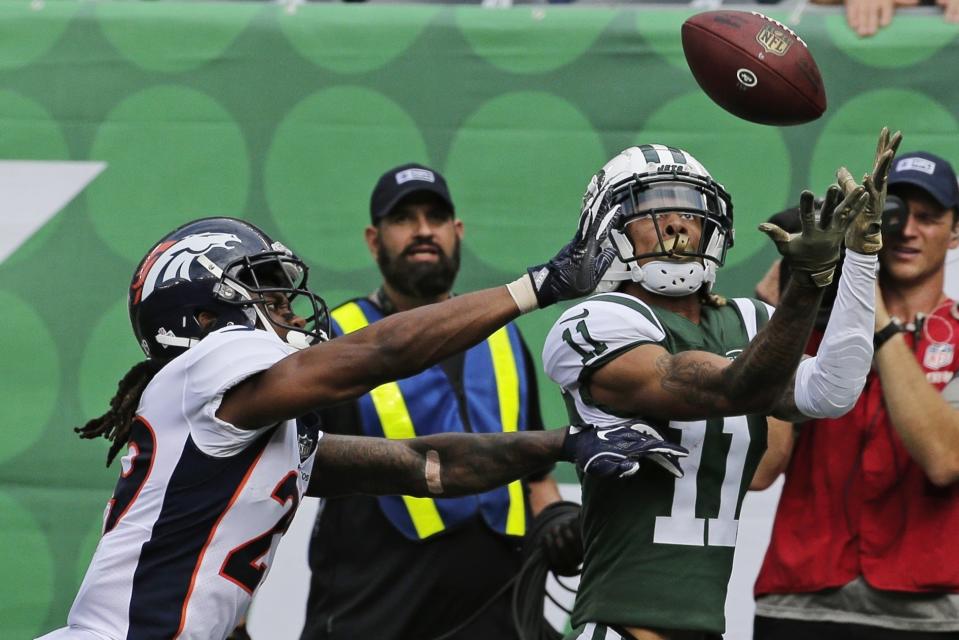 New York Jets' Robby Anderson (11) catches a pass in front of Denver Broncos' Bradley Roby (29) for a touchdown during the first half of an NFL football game Sunday, Oct. 7, 2018, in East Rutherford, N.J. (AP Photo/Seth Wenig)