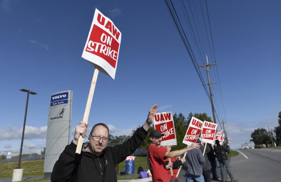 Members of UAW Local 171 picket outside a Mack Trucks facility in Hagerstown, Md. after going on strike Monday, Oct. 9, 2023. Workers voted down a tentative five-year contract agreement that negotiators had reached with the company. (AP Photo/Steve Ruark)