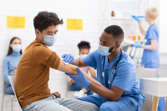 A patient is vaccinated during a doctor appointment.