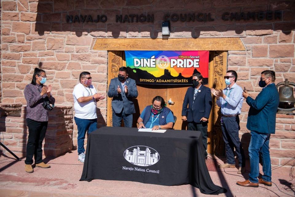 Speaker of the Navajo Nation Seth Damon signs on July 31, 2020 a Navajo Nation Council resolution designating every third week in June Diné Pride Week.