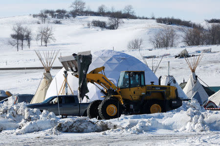 Crews remove waste from the opposition camp against the Dakota Access oil pipeline near Cannon Ball, North Dakota, U.S., February 8, 2017. REUTERS/Terray Sylvester