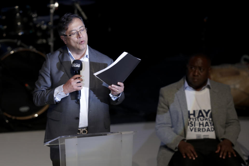 President-elect Gustavo Petro speaks during a ceremony to release a truth commission's final report regarding the country's internal conflict, in Bogota, Colombia, Tuesday, June 28, 2022. A product of the 2016 peace deal between the government and the Revolutionary Armed Forces of Colombia, FARC, the commission was tasked to investigate human rights violations committed by all actors between 1958 and 2016. (AP Photo/Ivan Valencia)