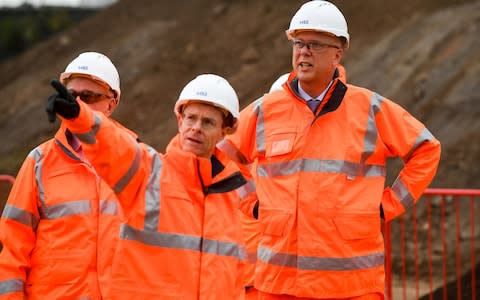  Secretary of State for Transport, Chris Grayling (right) meets with construction workers at the Old Curzon Street station site, Birmingham, where work is underway to build the HS2 terminal - Credit: Ben Birchall/PA