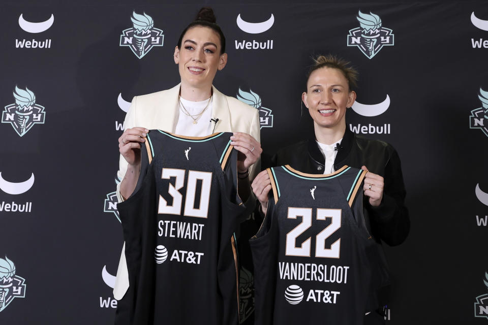 FILE - New York Liberty forward Breanna Stewart and guard Courtney Vandersloot pose for a photo during a news conference on Feb. 9, 2023, in New York. The WNBA is set to tip off its 27th season on Friday, May 19. (AP Photo/Jessie Alcheh, File)