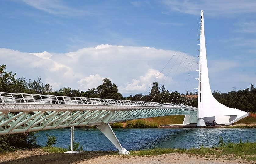 ** ADVANCE FOR THE WEEKEND OF JULY, 3-4 **The Sun Dial Bridge is seen from the Sacramento River, Monday, June 28, 2004, in Redding, Calif. The 700-foot-long, 23-foot-wide footbridge was designed by world-famous architect, engineer and artist Santiago Calatrava, who also designed the Olympic Sports Complex for the Athens 2004 Summer Games. (AP Photo/Ben Margot)