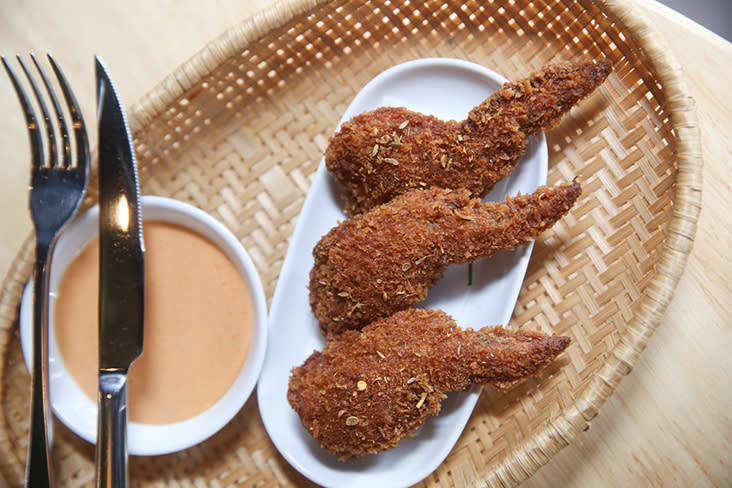 Who doesn't love chicken wings? These are crispy and stuffed with glutinous rice and Thai fermented sausages.