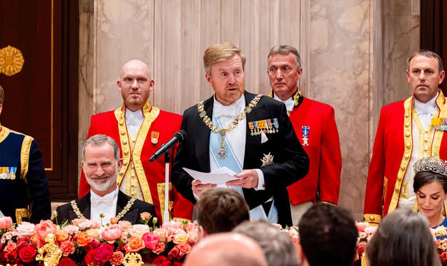 <p>Patrick van Katwijk/Getty</p> King Willem-Alexander of the Netherlands (center) gives a speech at the state banquet on April 17, 2024