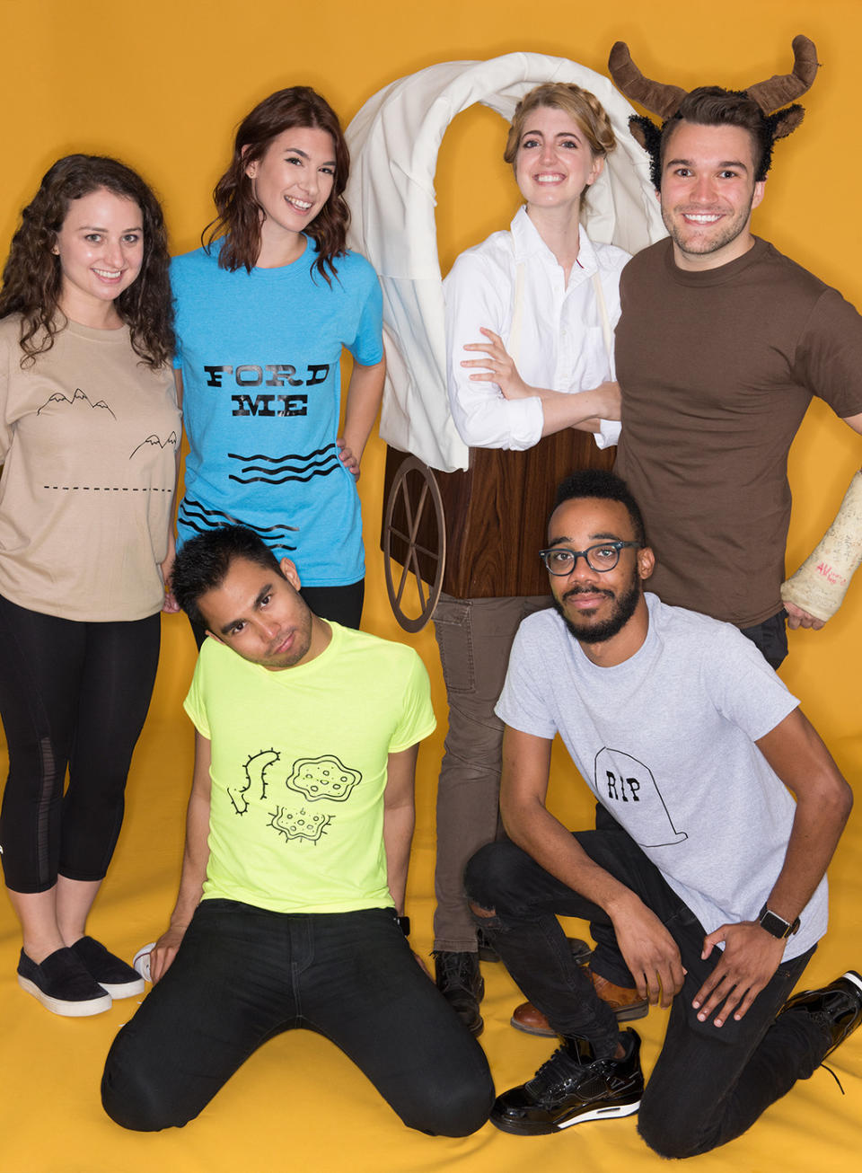 Six people wearing T-shirts with different designs, including "RIP" and "Ford Me"