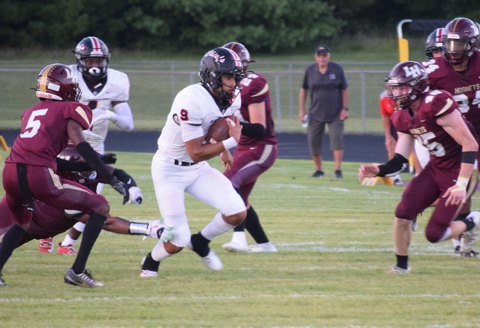 Bellefontaine's Tavien St. Clair breaks into the center of the Licking Heights defense on Friday.