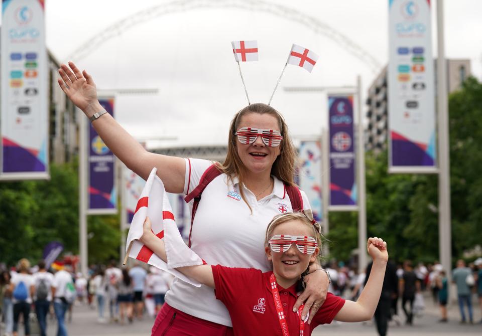 England fans pose for a photo on Wembley Way (Joe Giddens/PA) (PA Wire)