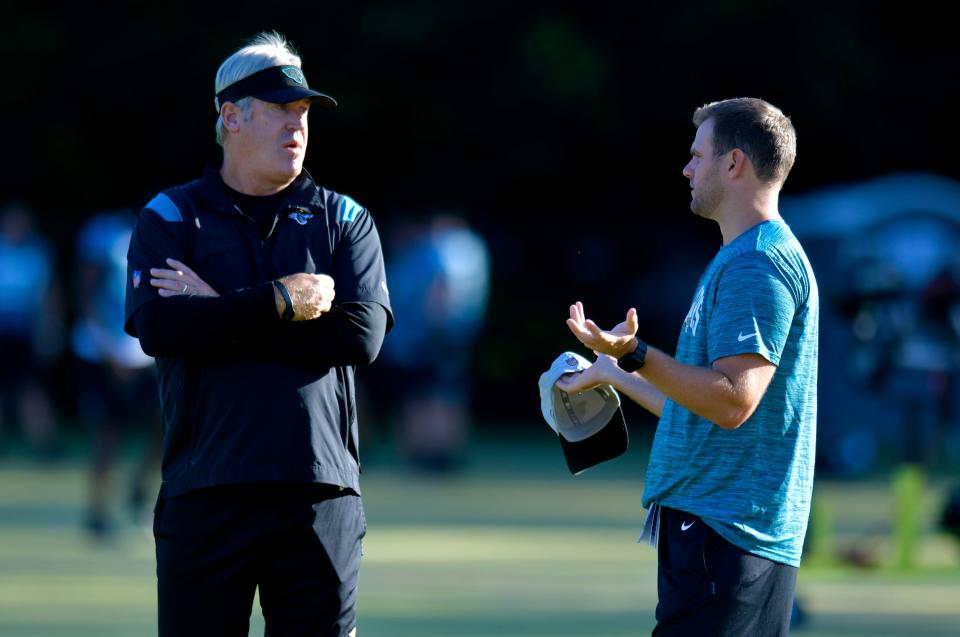 Jacksonville Jaguars head coach Doug Pederson talks with offensive coordinator Press Taylor on the field ahead of the start of Wednesday morning's training camp session. The Jacksonville Jaguars held their third day of training camp Wednesday, July 27, 2022, at the Episcopal School of Jacksonville Knight Campus practice fields on Atlantic Blvd.
