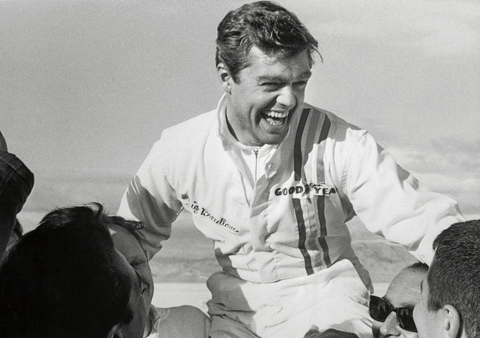 original caption daring craig breedlove is lifted into the air by his happy crew november 15th after becoming the first man to crack the 600 miles per hour land speed barrier breedlove sped down the measured mile here in a two way average speed of 600601 mph, breaking the old record of 576553 mph by art arf on november 7th