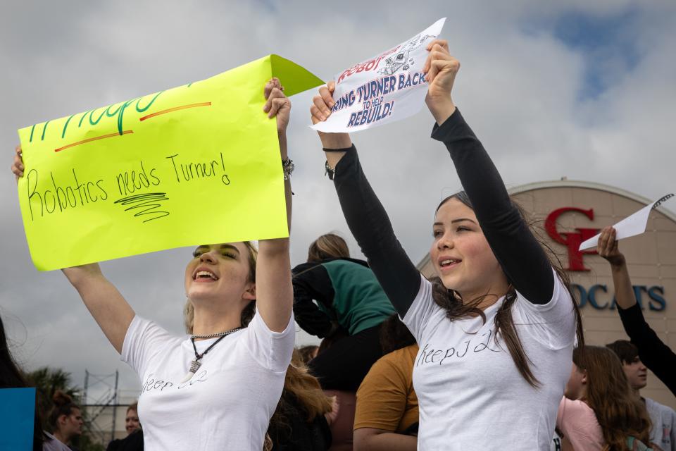 Sisters from left, Vivien, a senior, and Cassidy Gordon, a freshman, participate in a walkout at Gregory-Portland High School on Wednesday, Feb. 21, 2024, in Portland, Texas.