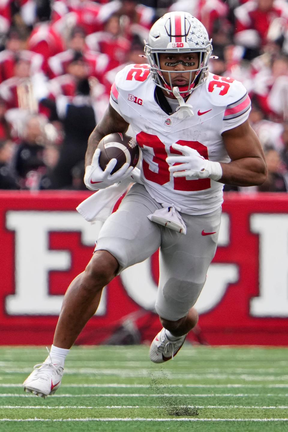 Nov 4, 2023; Piscataway, New Jersey, USA; Ohio State Buckeyes running back TreVeyon Henderson (32) runs upfield during the NCAA football game against the Rutgers Scarlet Knights at SHI Stadium. Ohio State won 35-16.