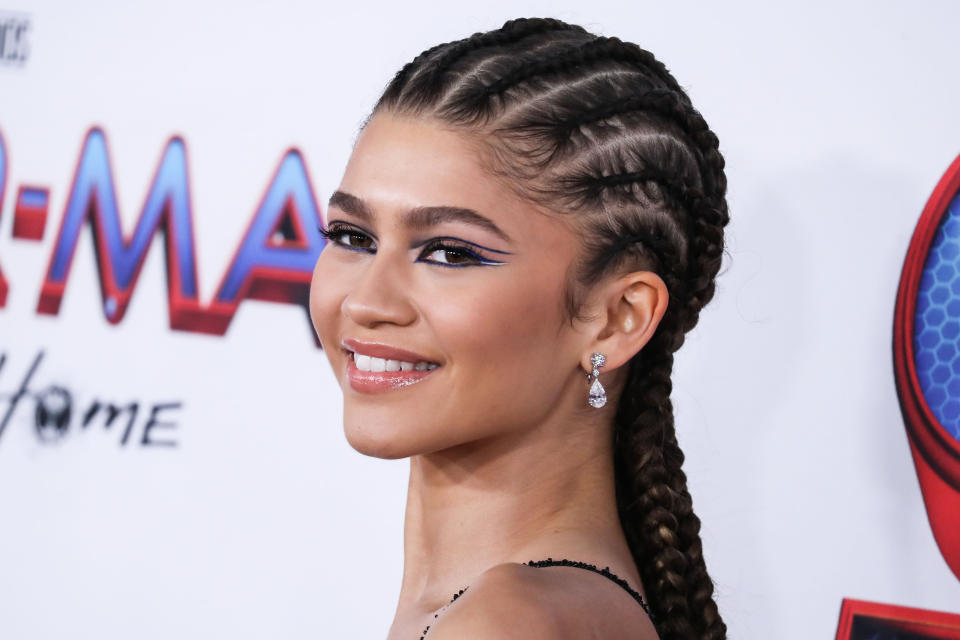 WESTWOOD, LOS ANGELES, CALIFORNIA, USA - DECEMBER 13: Actress Zendaya Coleman wearing a Valentino dress, Bvlgari jewelry, and Christian Louboutin heels arrives at the Los Angeles Premiere Of Columbia Pictures' 'Spider-Man: No Way Home' held at the Regency Village Theatre on December 13, 2021 in Westwood, Los Angeles, California, United States. (Photo by Xavier Collin/Image Press Agency/Sipa USA)