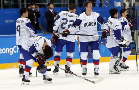 Ice Hockey - Pyeongchang 2018 Winter Olympics - Men’s Playoff Match - Finland v South Korea - Gangneung Hockey Centre, Gangneung, South Korea - February 20, 2018. South Korea's reacts players after the match. REUTERS/Kim Kyung-Hoon