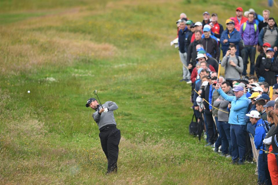 US golfer Webb Simpson hits out from the rough on the second hole during the first round of the British Open golf Championships at Royal Portrush golf club in Northern Ireland on July 18, 2019. (Photo by Glyn KIRK / AFP)