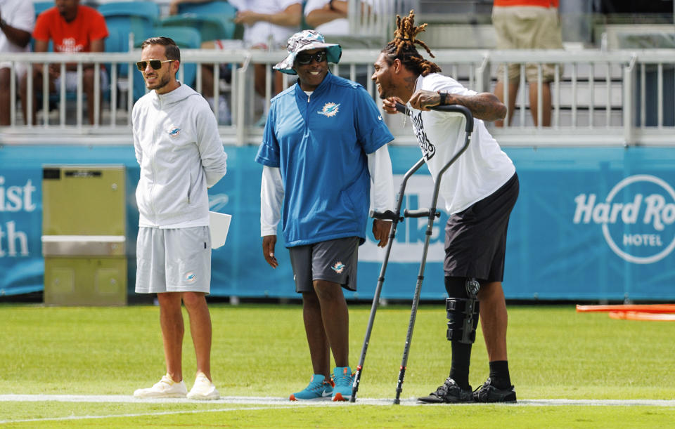 Miami Dolphins cornerback Jalen Ramsey (5) talks with Dolphins head coach Mike McDaniel and Dolphins general manager Chris Grier during NFL football training camp at Baptist Health Training Complex in Hard Rock Stadium on Thursday, Aug. 3, 2023 in Miami Gardens, Fla. (David Santiago/Miami Herald via AP)