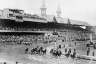 FILE - Hoop Jr. (2) leads by a length as the Kentucky Derby field rounds at Churchill Downs at Louisville, Kent., June 9, 1945. Bymeabond (10) is second. Hoop retained the lead to go on to win the race. America’s longest continuously held sporting event turns 150 years old this Saturday. By age, it’s got the Westminster dog show beat by two years. The Derby has survived two world wars, the Great Depression, and pandemics. (AP Photo/File)