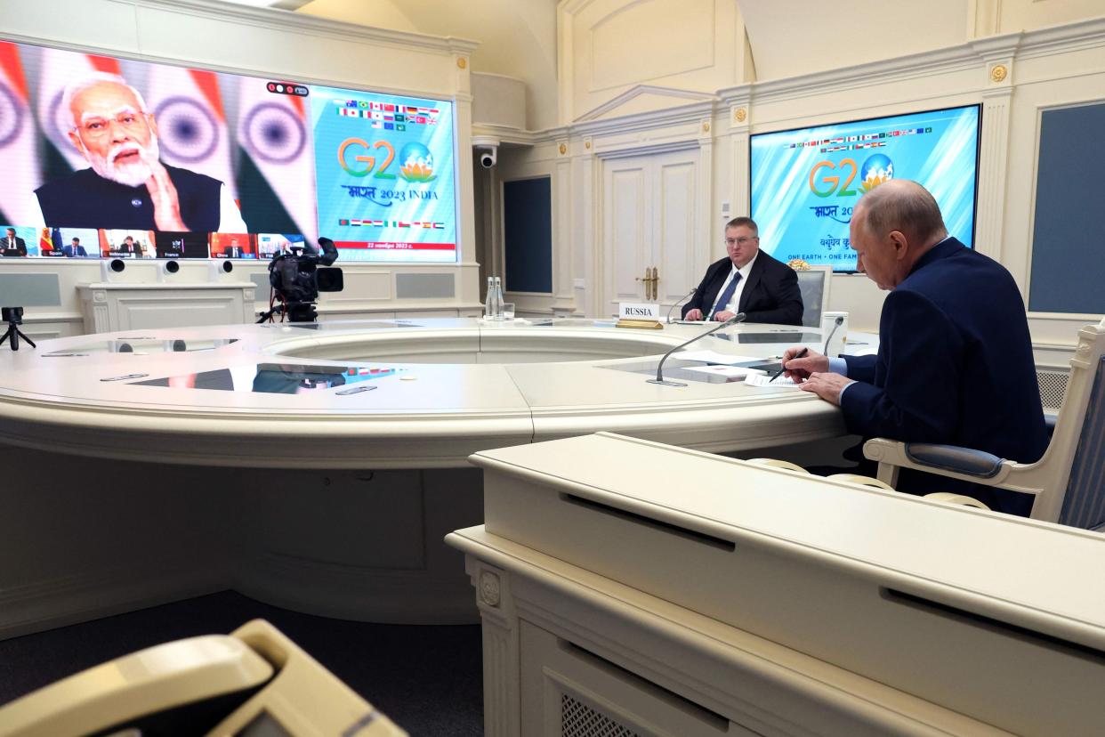 Vladimir Putin speaks during a virtual G20 summit hosted by Indian prime minister Narendra Modi (POOL/AFP via Getty Images)