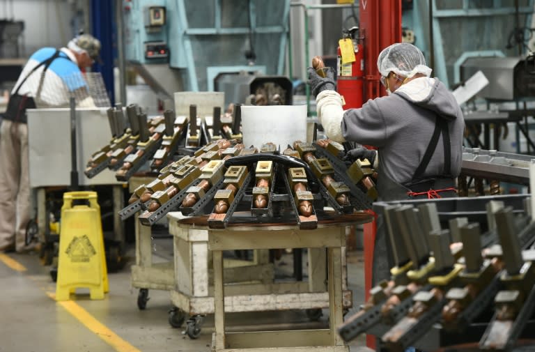 Workers remove sex toys from metal molds at the Doc Johnson factory in Los Angeles