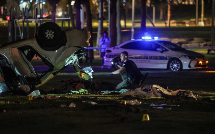 Forensics investigators at the scene in Tel Aviv - Ilia Yefimovich/Avalon