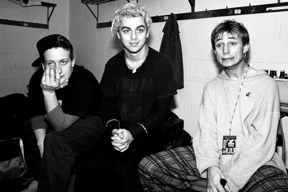 <p>Catherine McGann/Getty</p> Green Day (Tré Cool, Billie Joe Armstrong, Mike Dirnt) in 1994