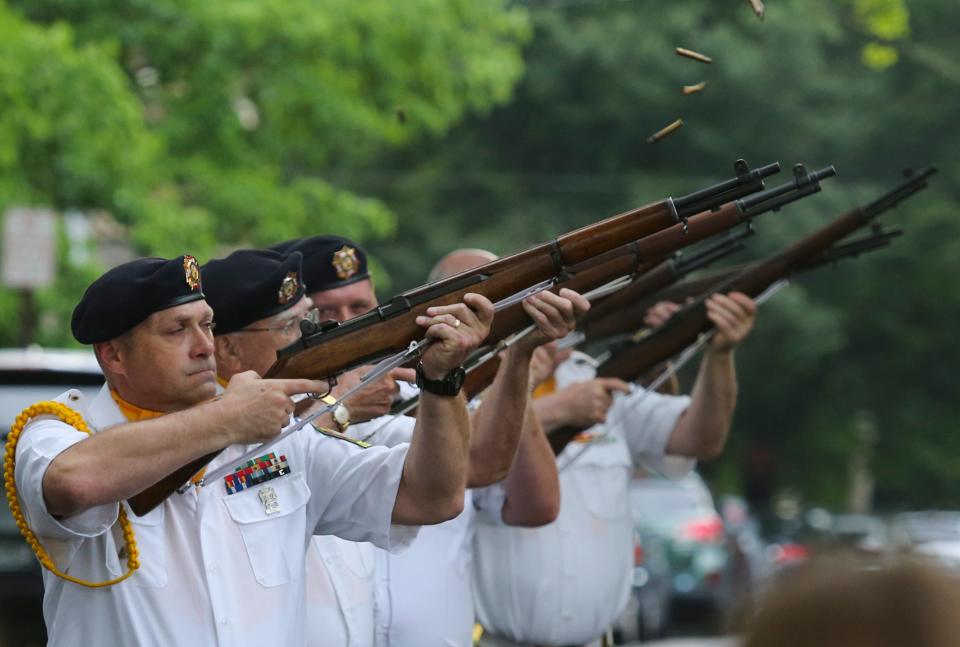 The VFW Post #475 Rifle Team fires a salute during the Wilmington Memorial Day ceremony at the Delaware Soldiers and Sailors monument in 2019.