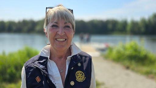 Fredericton North Rotary Club's Bonny Hoyt-Hallett in front of new Killarney Accessibility dock.