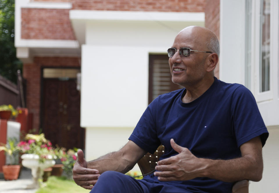 Puranjan Acharya, an independent analyst, speaks with the Associated Press during an interview at his residence in Kathmandu, Nepal, Friday, May 29, 2020. Nepal's latest border dispute with India, that has strained relations between the two South Asian countries with centuries-old historical, cultural and economical ties, has brought tiny Himalayan nation's bickering political parties together in a rare show of unity. ”It is just not the political parties but the whole population that is backing the government on the issue,” said Acharya. (AP Photo/Niranjan Shrestha)